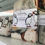 Lovely puffin art tea towels & aprons